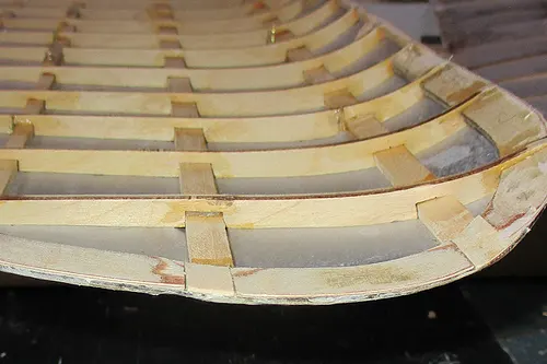 Blériot model aircraft wing showing pronounced curvature and rib structure during construction
