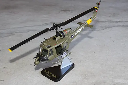 Super Wings UH 1 Huey prototype toy model on a display stand built for IMC Models