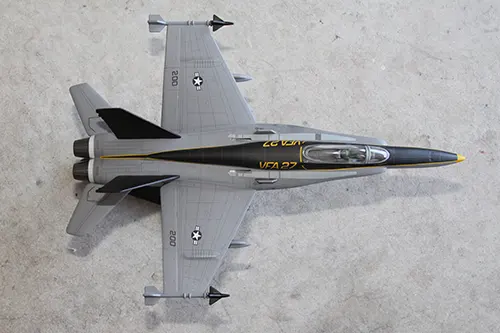 Overhead view of Super Wings F A 18 Hornet prototype toy model on a display stand